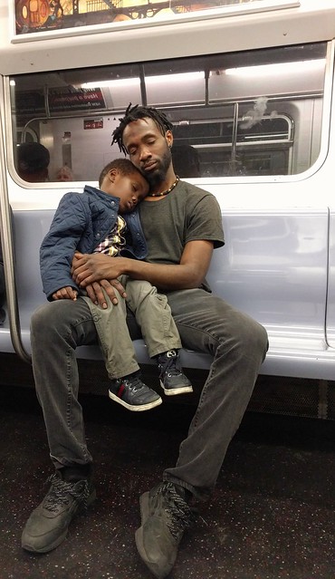 A father and son catching a NY minute... after a rough day at preschool.