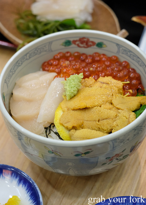 Hokkaido sashimi scallop, squid, sea urchin roe and salmon roe set from Asaichi Shokudo Makoto Yasube at Hakodate Morning Market, Hokkaido