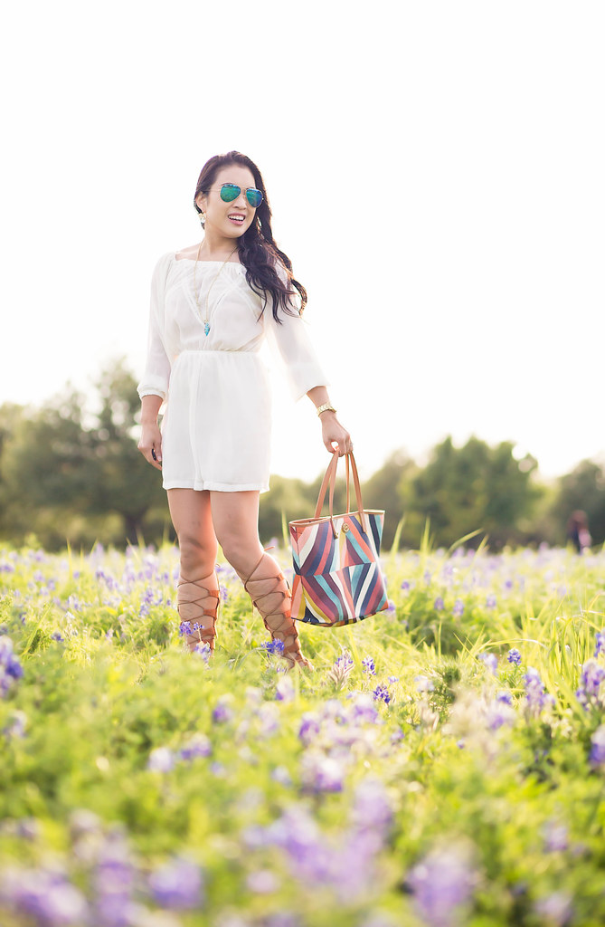 cute & little blog | white off-shoulder romper, lace-up gladiator sandals, tory burch kerrington bag, ray ban blue mirror aviators | texas bluebonnets | spring summer outfit