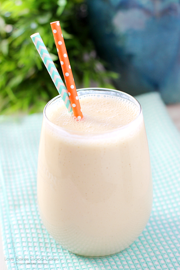 Peach-Banana Oatmeal Smoothie in a glass with a straw 