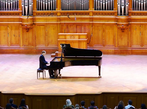 Piano soloist performing on large stage