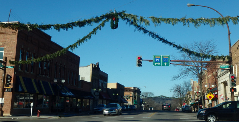 four garland strands at the street corners, meeting at a wreath in the middle