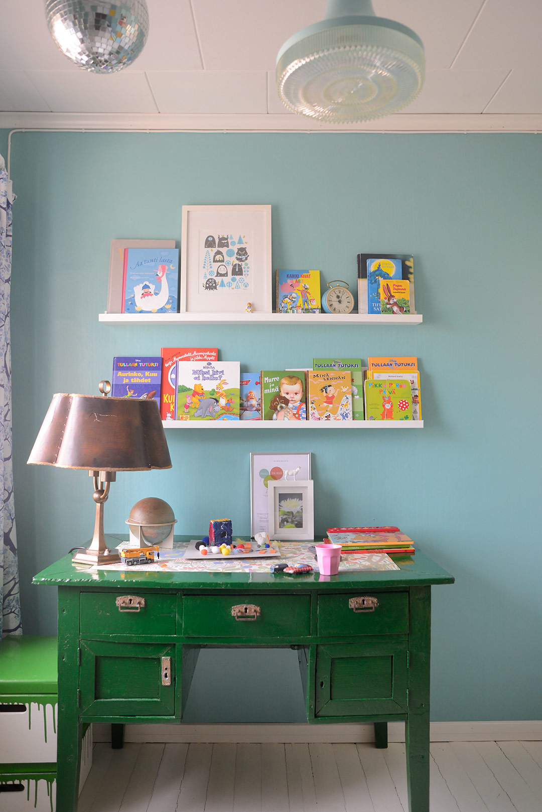 Green vintage writing table and Ikea Ribba picture ledges as book shelves