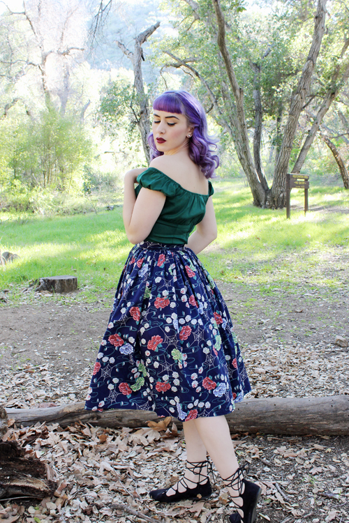 Pinup Girl Clothing Pinup Couture Peasant Top in Dark Green Pinup Couture Jenny Skirt in Floral Web Print