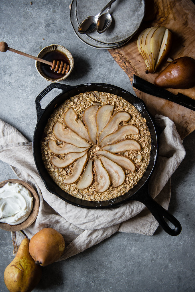 poached pear baked oatmeal | two red bowls