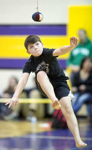 William Wilson competes in the one-foot high kick, an event that demands strength, flexibility and focus, during Kenaitze's Native Youth Olympics Invitational.