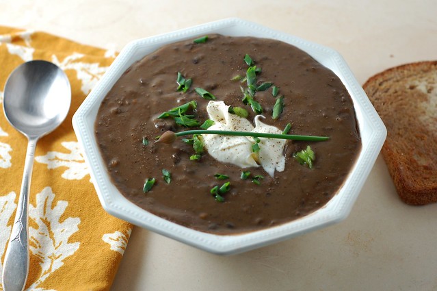 Black bean soup topped with creme fraiche and chives by Eve Fox, the Garden of Eating, copyright 2016