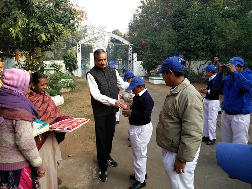 Distribution of sweets by the Chief Guest