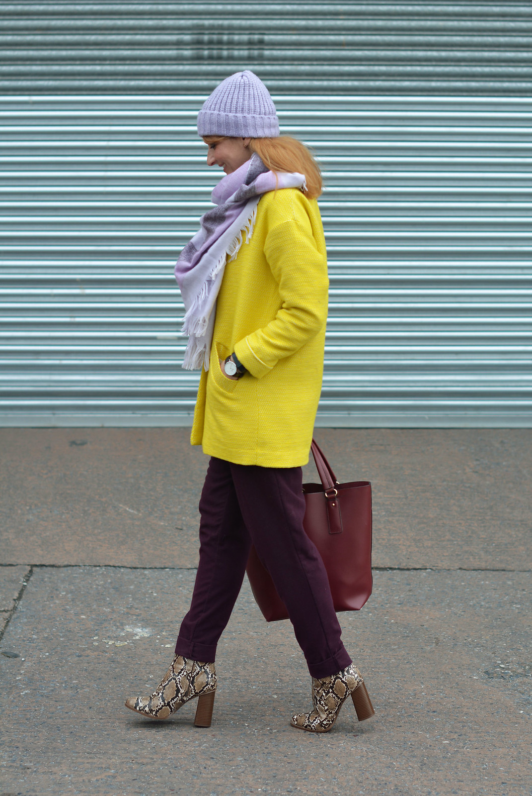 Bright winter outfit | Yellow coat, purple trousers, lilac scarf & hat, snakeskin boots