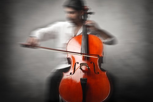 creative portrayal of cellist playing dramatically
