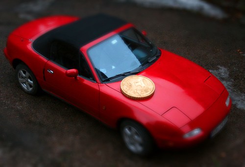 Big coin, smll car