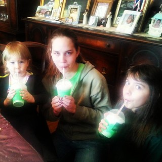 Virginia Mcguirk's granddaughters and great granddaughter drinking their shamrock shakes on st.  Patrick's day!