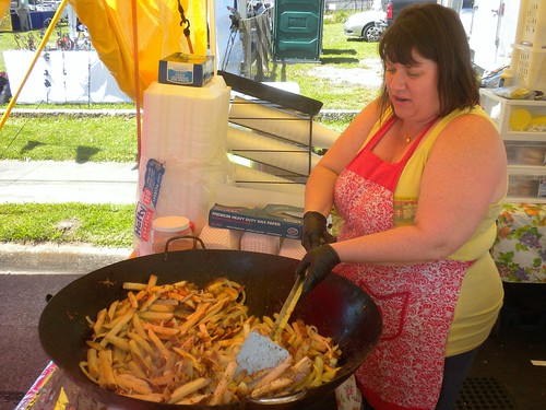 woman hot festival lady paper fun fry spring potatoes arms muscle cook apron onions southern fragrant oil carolina wax sliced stir heavy stgeorge premium grits dorchester starch sizzle inions