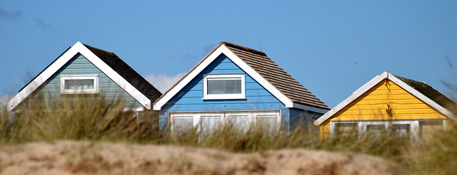 Huts appearing from the dunes