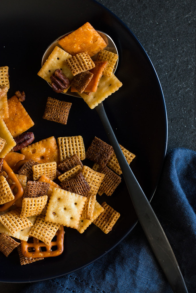 Texas Trash is the perfect party mix for snacking on while watching football playoffs. This spicy mix of cereals, small crackers, and pecans couldn't be any easier thanks to the convenience of your slow cooker.