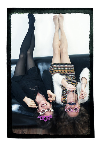 two woman hot sexy beautiful beauty face female studio fun glasses donna twins women funny faces mask legs upsidedown pair flash moustache sofa masks extraordinaire brille frau funnyfaces silvester newyearparty homestudio legfetish kleid differentpointofview blixt happyvalentine shortrock