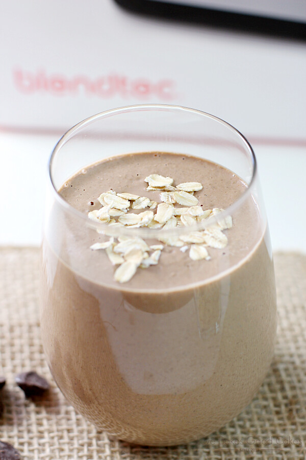 Chocolate Peanut Butter Oatmeal Smoothie in a glass with oatmeal and chocolate chips.