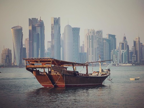 old travel sunset sea sun water modern buildings square boat ancient ship gulf olympus explore squareformat rise omd doha qatar sund em1 katar qatr iphoneography instagramapp uploaded:by=instagram