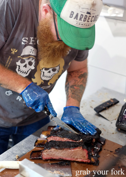 Wes Griffiths slicing barbecued brisket at Bovine & Swine, Enmore Sydney food blog review