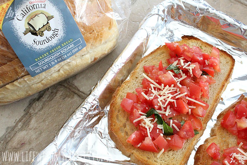 This fresh tomato bruschetta recipe is made on freshly baked sourdough bread and is topped with a tomato basil mix and Parmesan cheese! It's the perfect appetizer or side dish for any Italian meal! And it's DELICIOUS!