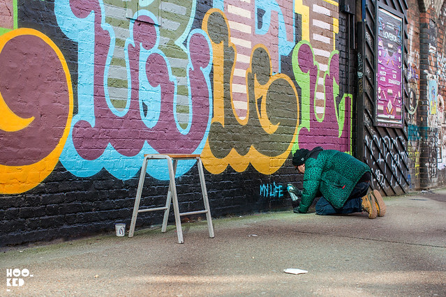Brick Lane Street Art by British street artist Ben Eine, titled 'REBEL REBEL'