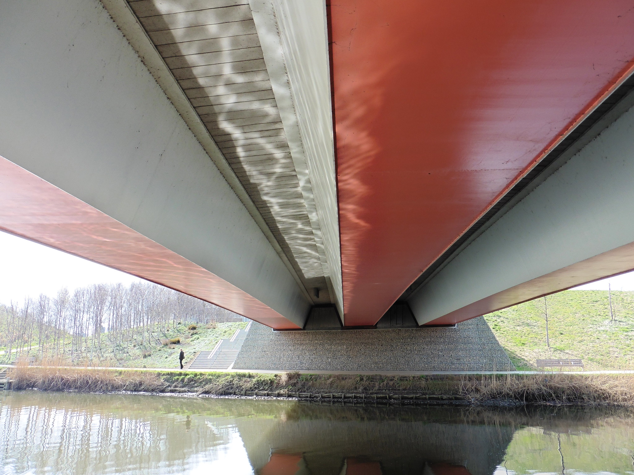 Reflection of river in bridge in colour