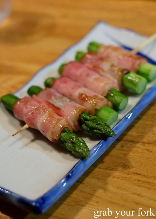 Asparagus wrapped in bacon skewers at an izakaya in Hakodate, Hokkaido