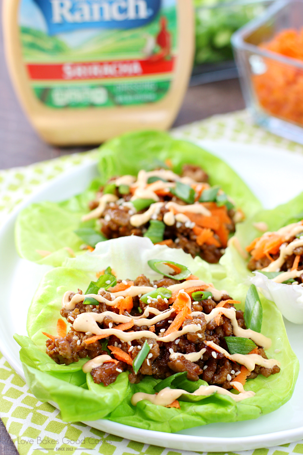 Asian Pork Lettuce Wraps on a plate with a bottle of Hidden Valley Ranch.