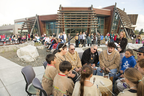 The Del Dumi Drum group performs in front of the Dena'ina Wellness Center during the Raven Plaza dedication.