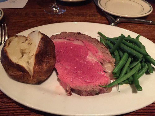 Rare prime rib, dry baked potato and green beans without butter