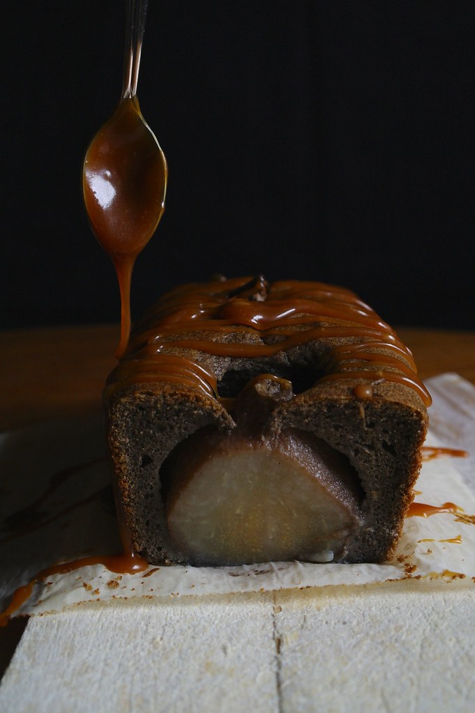 drizzling caramel over poached pear cake