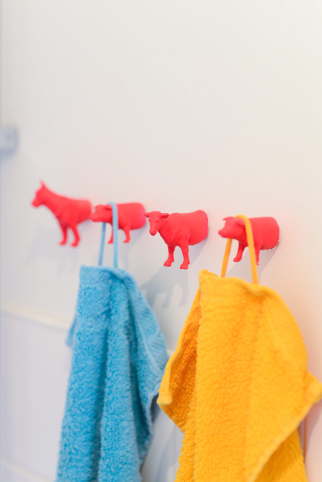 DIY towel hooks made from plastic toy animals