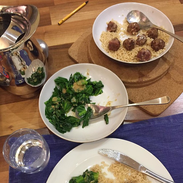 Dinner tonight: meatballs, rice and spring greens. I've been thinking about what 'easy' weeknight cooking looks like. This fits the bill for me: meatballs made last night and finished in the oven this evening. A microwave pack of brown rice. Spring greens