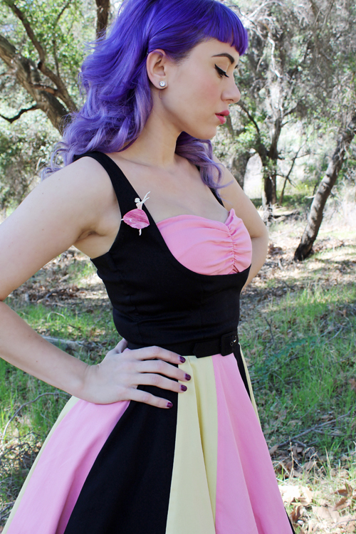 Pinup Girl Clothing Pinup Couture Just Desserts Dress in Black with Pink and Yellow Deer Arrow Tiny Dancer Brooch
