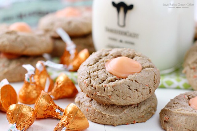 Carrot Cake Blossom Cookies stacked up with a bottle of milk.