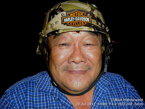 cultural character adult portrait crashhelmet camouflage smiling ethnic posing primelens consent respect authentic closeup street eyes asia flash matthahnewaldphotography face facingtheworld stubble horizontal head malaysia malaysianchinese helmet night outdoor pahang southeastasia temerloh travel oneperson panasoniclumixdmctz5 expression headshot motorcyclist fullfaceview clarity 4x3ratio 1200x900pixels resized lookingatcamera colourful colour