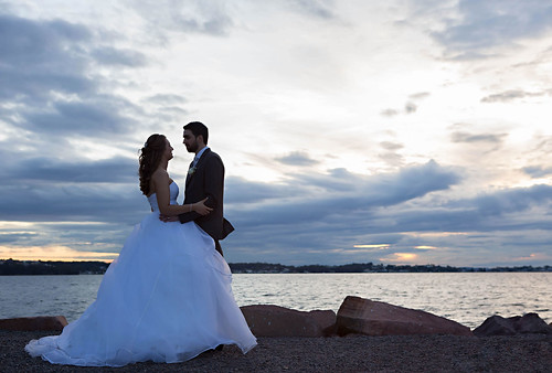 The bride and groom by the water.