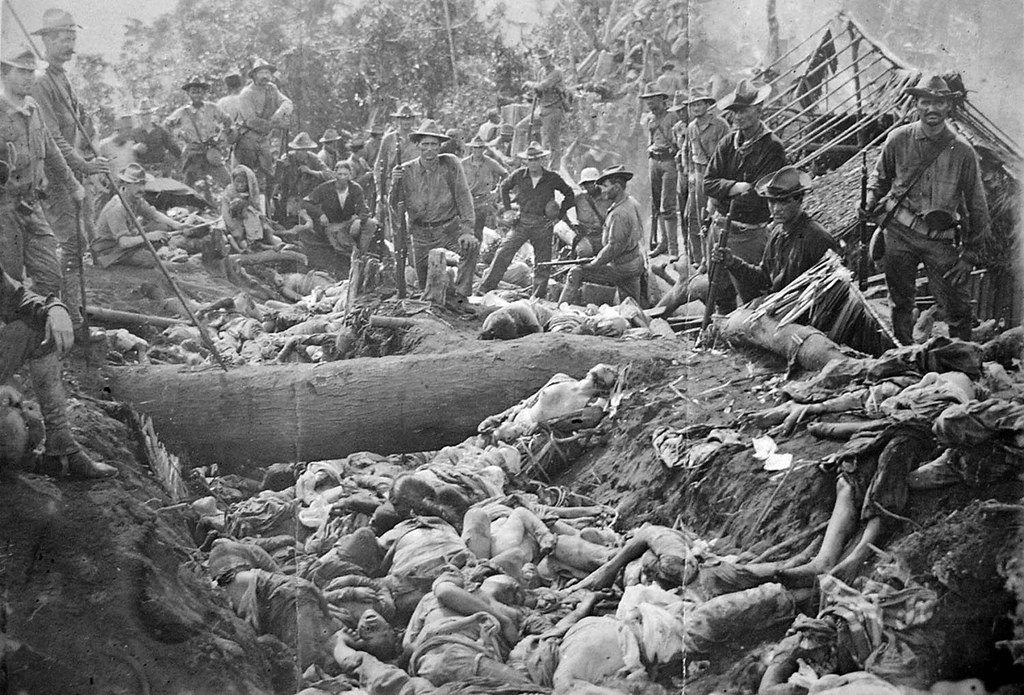US soldiers pose with the bodies of Moro insurgents, Philippines, 1906