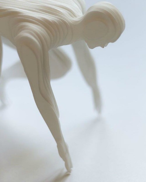 all-white 3D paper sculpture runner
