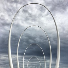 The Spanda sculpture in Elizabeth Quay represents ripples and links the Swan River, land and sky.