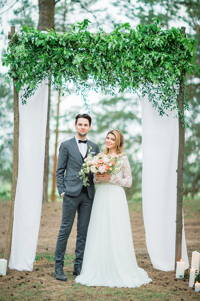 Greenery and tulle wedding arch for a Romantic Woodland Wedding Inspiration { Soft Peach Tones } | Photo by Igor Kovchegin Photography | Read more on Fab Mood - UK wedding blog