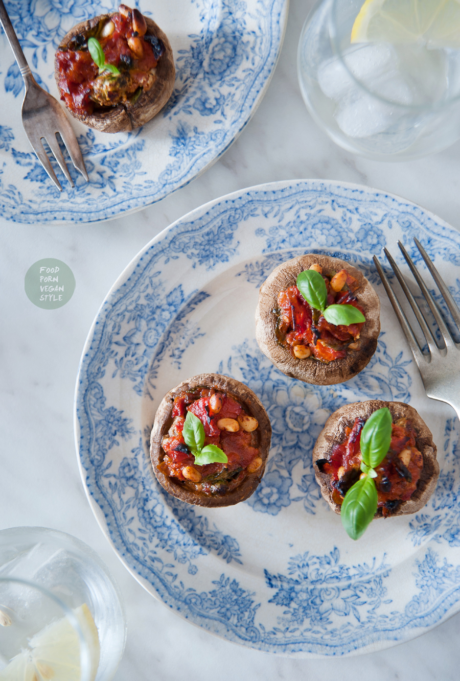 Baked stuffed mushrooms with sun-dried tomatoes, basil and pine nuts
