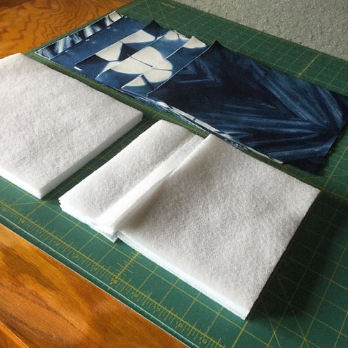 So much of making a bag is unseen in the final product by oh so necessary! I've fused SF101 interfacing to the wrong side of the #indigodyed cotton sateen, now I cut the fronts apart and fuse fleece that has been cut slightly smaller to the back side as w