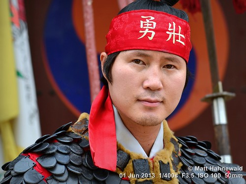 portrait muyedobotongji martialartist performer bokeh travel tourism ethnic costume photo manly handsome primelens artist uniform male adult posing respect red street color eyes cultural traditional asia matthahnewaldphotography face facingtheworld colorful eastasia horizontal hwaseonghaenggung korean nikond3100 outdoor southkorea suwon military man 50mm oneperson seveneighthsview headshot nikkorafs50mmf18g lookingcamera 4x3ratio 1200x900pixels resized