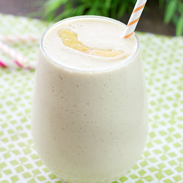 Peach & Oatmeal Smoothie in a glass with a straw.