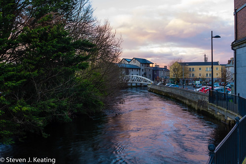 street city ireland sunset wet water skyline clouds reflections river spring rooftops bubbles ennis waterways countyclare riverfergus