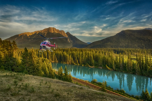 blue trees light sunset sky cloud sun mountain canada color colour reflection tree green nature water colors rock clouds contrast forest river landscape outdoors colours bright outdoor dusk sony helicopter alberta banff goldenhour wimvandem