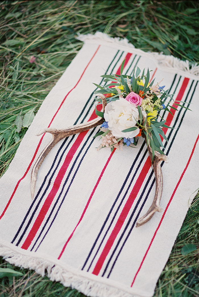 Antlers with vibrant wild flowers for Bohemian wedding inspiration shoot in the countryside with a dose of vibrancy | photo by Igor Kovchegin | Fab Mood - UK wedding blog #bohemian
