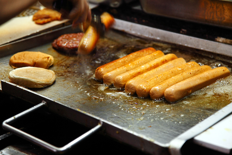 Om Burger Frying Jumbo Hot Dog