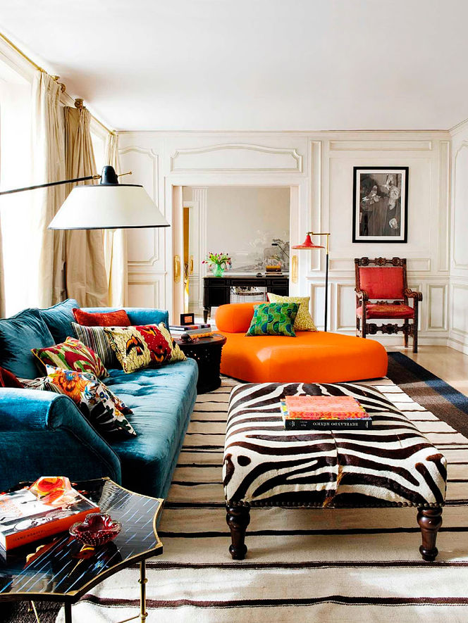 Bold Colorful Home Decor Inspiration | Living Room Decorating Ideas | Orange Chair | Zebra Ottoman | Blue Velvet Couch
